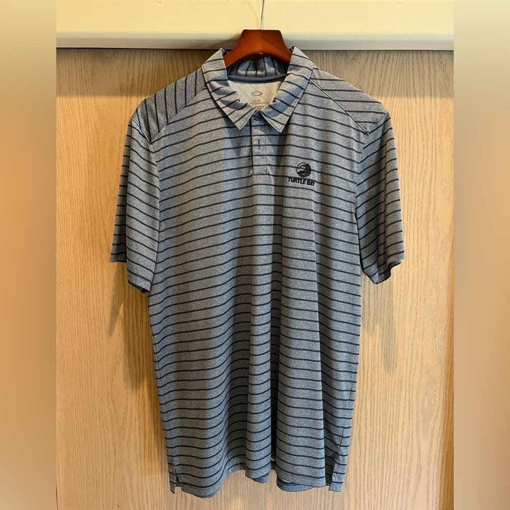Oakley Golf Shirt. New, with out tags. Never worn or washed. Turtle Bay Hawaii